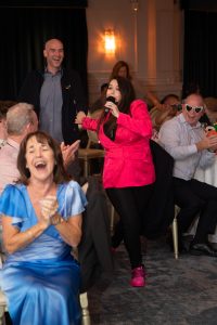 Hypnotist Sarah-Jane calls on an unsuspecting audience member to take part in the show.
